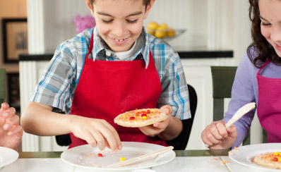 A young person is making sun cookies