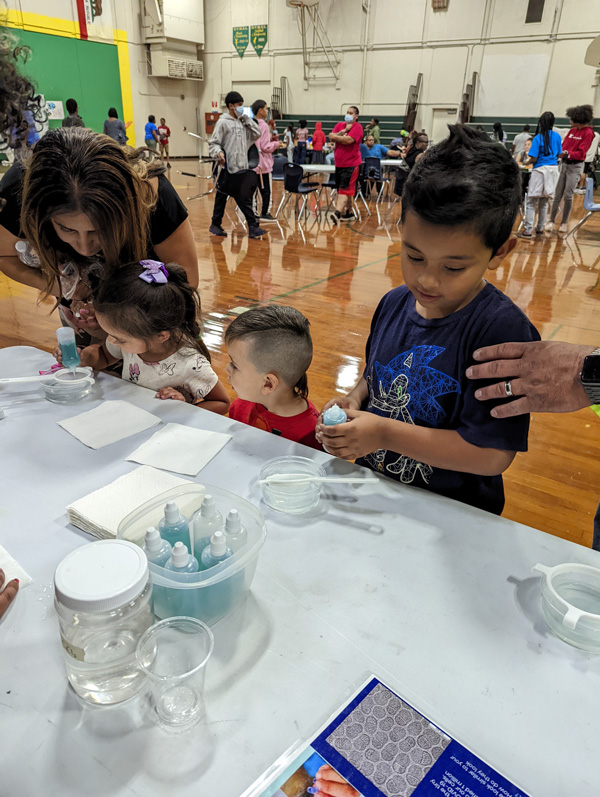 Children are participating in a science activity about delivery capsules