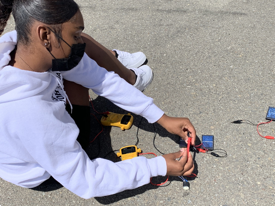 A student is working on a solar project.