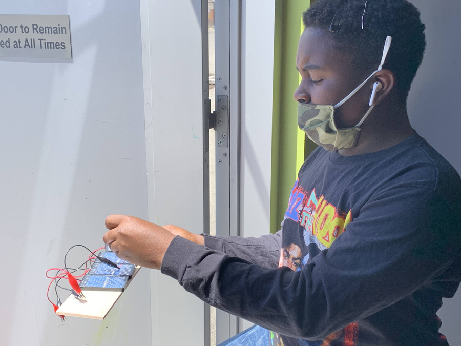 A student is working on a solar project.
