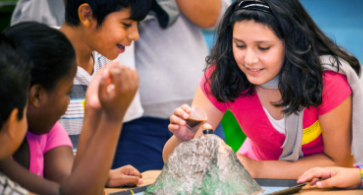 Students working on a science project together