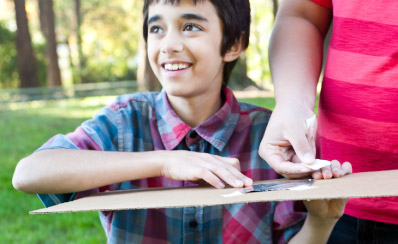 A close up of a child working on a science project