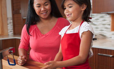 An adult and child standing together