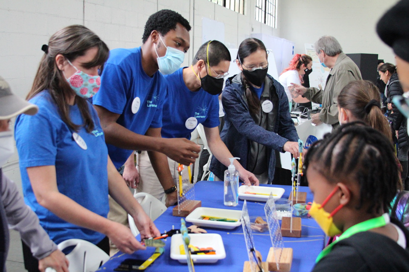 The Lawrence On-The-Go team is at a community event facilitating science activities