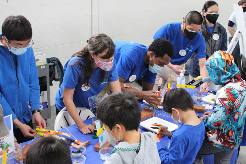 The Lawrence On-The-Go team is at a community event facilitating science activities
