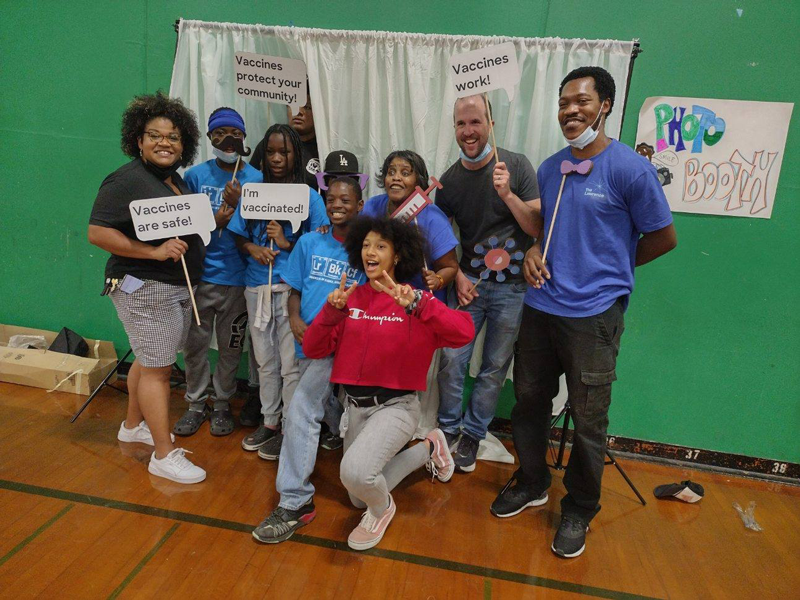 A group photo of Lawrence On-The-Go staff and community members