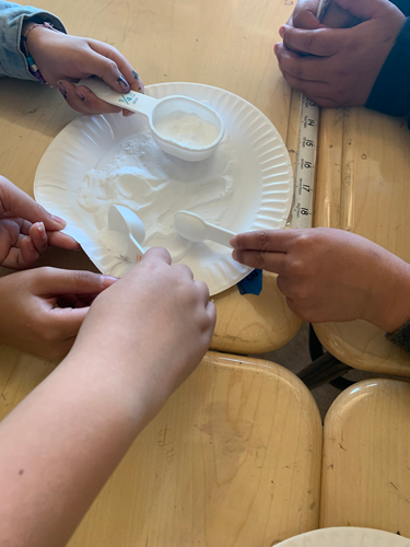 Students participate in a Make Math REAL activity.