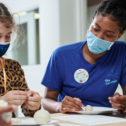 A teen intern is working with youth.