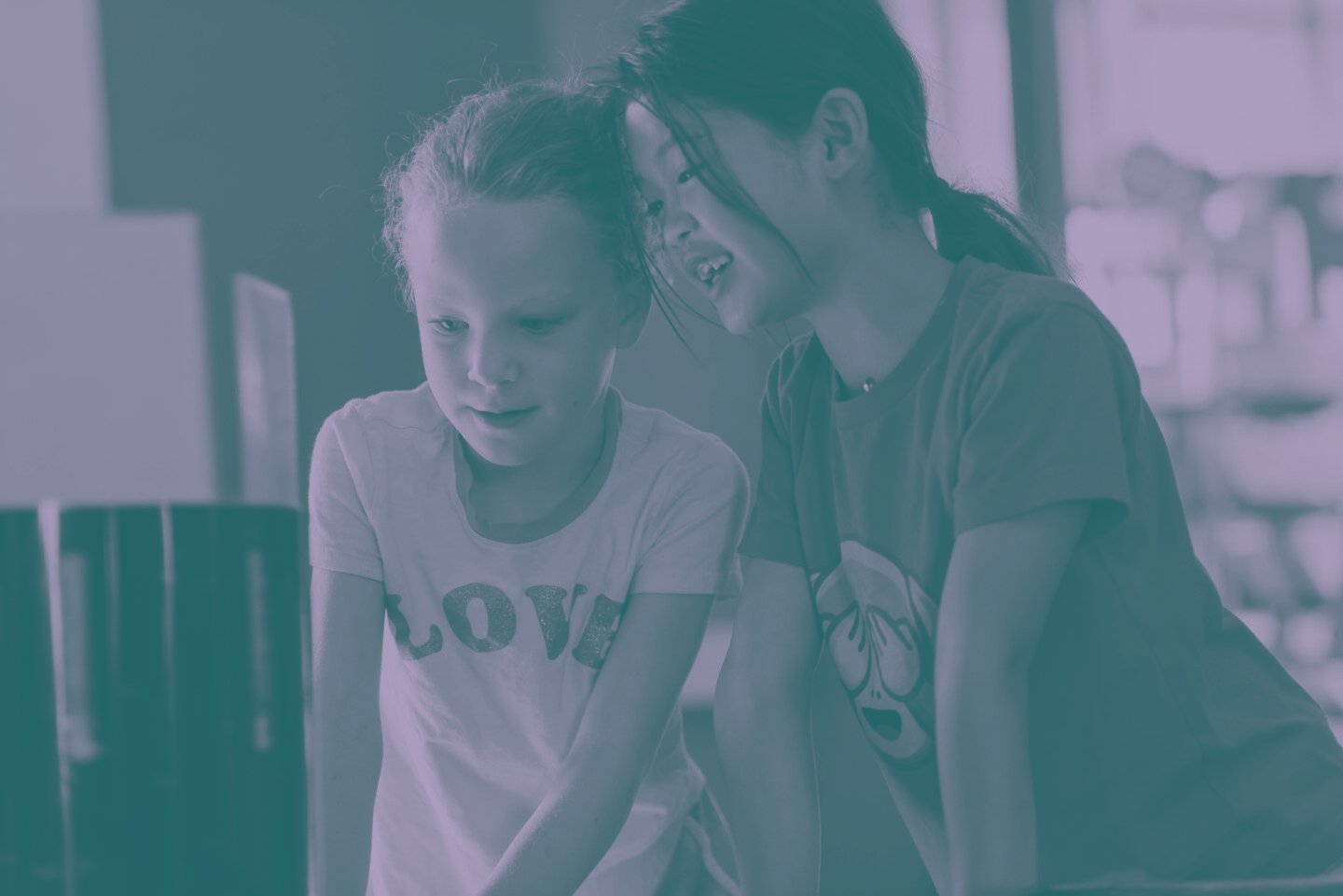 Two young people explore an exhibit at The Lawrence.