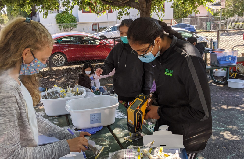 Students analyze soil samples in the community